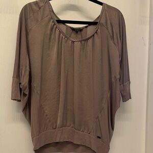 Guess dolman sleeve top with a keyhole (slit) opening on the back. EUC